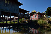 Inle Lake Myanmar. All the buildings are constructed on piles. Residents travel around by canoe, but there are also bamboo walkways and bridges over the canals, monasteries and stupas. 